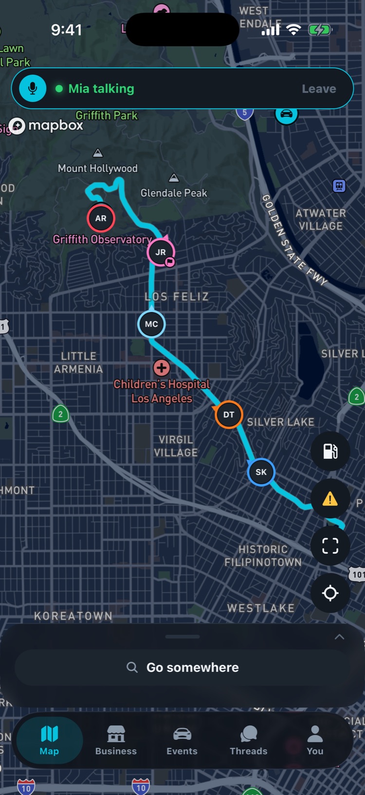 Paddock map with five cars in a convoy along one route, each marked with the driver's initials